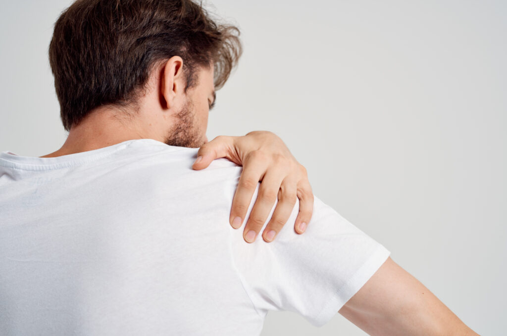 bearded man pain in the neck health problems massage therapy studio treatment. High quality photo